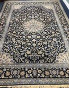 A Tabriz style blue ground carpet 388 x 279cm