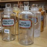 A collection of eight late Victorian chemist's dry drug jar and stopper, with gilt framed named