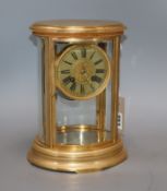 A 19th century French gilt brass four-hour mantel clock, of oval form, with silvered dial height