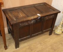 A small 17th century three panel oak coffer W.94cm