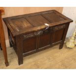 A small 17th century three panel oak coffer W.94cm