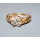A gold and diamond cluster ring, size O