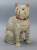 An early 20th century plush covered pull cord meowing cat