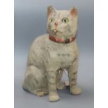 An early 20th century plush covered pull cord meowing cat