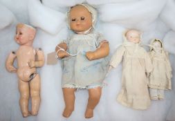 A 1950's Italian clockwork crying doll, a Heubach Koppelsdorf doll and two bisque dolls