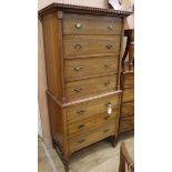 An Edwardian strung mahogany six drawer tallboy W.76cm, H.164cm