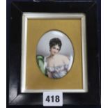 A 19th century German enamelled porcelain miniature of a coquettish young lady, 8 x 6.5cm