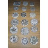 A collection of eighteen mainly black printed tooth,anchovy and other paste pot lids, including