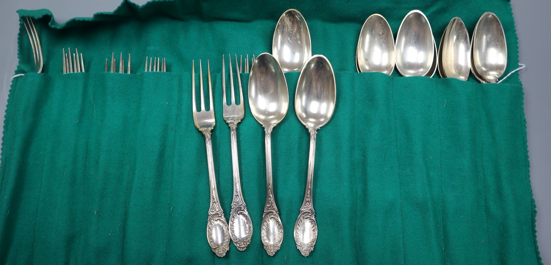 Twelve pairs of late 19th century Dutch silver dessert spoons and forks, J M van Kempen, minimum 0.