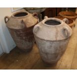 A pair of terracotta amphora H.78cm