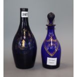 Two George III gilded blue glass decanters, one lacking stopper