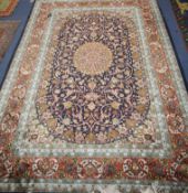 A Persian black ground rug 276 x 184cm