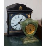 A 19th century cuckoo clock and an onyx timepiece