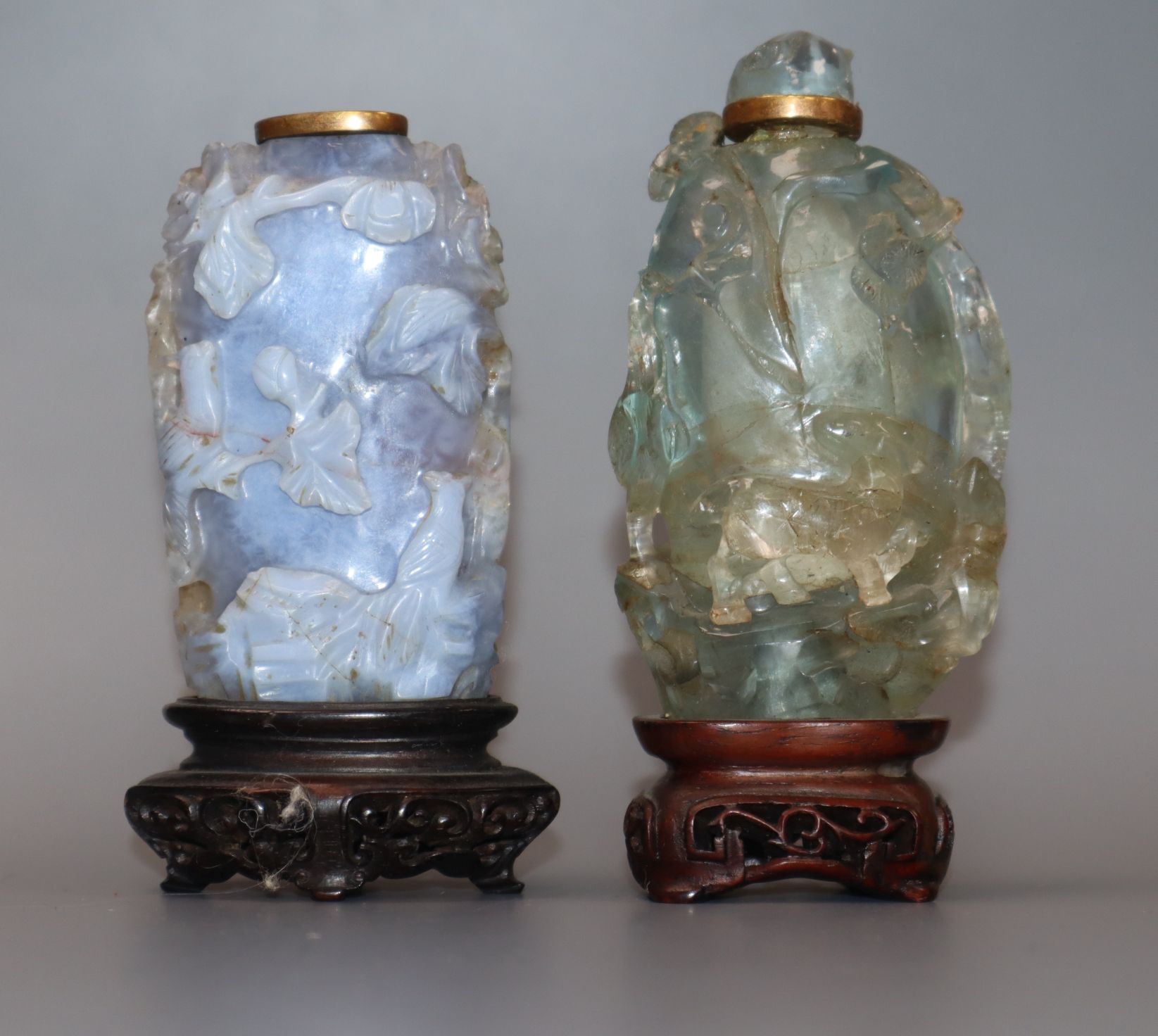 A Chinese agate snuff bottle and a similar green quartz snuff bottle