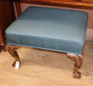 A Queen Anne style walnut stool, with green upholstery, carved cabriole legs and scrolled feet H.