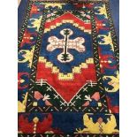 A Turkish blue ground rug 184 x 137cm