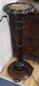 An early Victorian Anglo Indian carved hardwood cue stand H.97cm