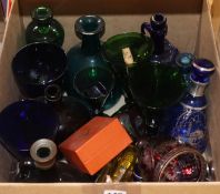 A collection of mixed coloured glassware