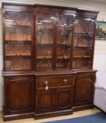 A Georgian style mahogany breakfront bookcase fitted four astragal-glazed doors H.228.5cm, W.214cm
