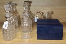 A 19th century cut glass decanter with mushroom stopper, a pair of decanters and stoppers and four