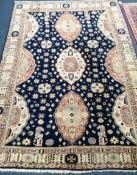 A Caucasian blue ground rug 220 x 149cm