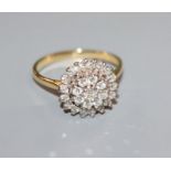An 18ct gold diamond cluster ring, size T