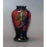 A Moorcroft miniature pomegranate baluster vase