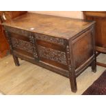 A 17th century style carved oak coffer W.119cm