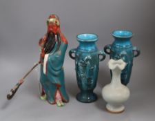 A Chinese celadon vase, a Chinese figure and two turquoise 'dragon' vases