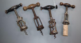 Four German coiled spring steel corkscrews, late 19th, early 20th century two with split barrels (