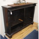 A 19th century carved oak open bookcase W.153cm