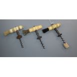 Three 19th century English Henshall type button steel corkscrews, with turned bone handles and