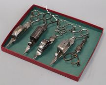 Five pairs of early 19th century steel candle snuffers, three with shutter mechanism, one stamped
