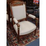 A pair of Empire-style mahogany elbow chairs