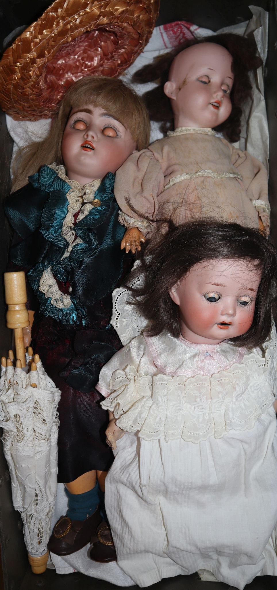 A Heubach 444 open mounted, pierced ears, jointed bisque headed doll in original costume and an