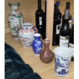 A Chinese blue and white sleeve vase and four others