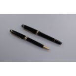 A Montblanc Meisterstuck fountain pen and ballpoint pen set fountain 14cm. ballpoint 13.75cm.