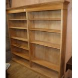 A large bleached mahogany open bookcase W.197cm