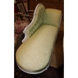 A Victorian white and gilt painted chaise longue