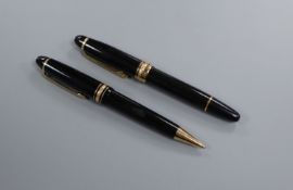 A Montblanc Meisterstuck fountain pen and ballpoint pen set fountain 14.5cm, ballpoint 14.75cm.
