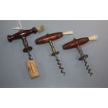 Three 19th century English Henshall type button wood handled corkscrews, one with brass shaft and