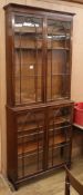 An early 19th century mahogany glazed bookcase (glass a.f.) W.96cm