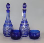 A pair of overlay blue decanters and two blue rinsers