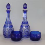 A pair of overlay blue decanters and two blue rinsers