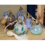 A collection of eight Caithness and other decorative glass perfume atomisers