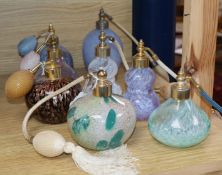 A collection of eight Caithness and other decorative glass perfume atomisers