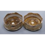 A pair of modern pierced silver George III style wine coasters, with oak bases, Birmingham 1963,