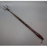 A George III bird roasting fork, with turned mahogany handle