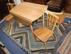 An Ercol drop leaf dining table and four chairs W.113cm