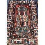 A Kazak red, blue and ivory ground rug 189 x 130cm